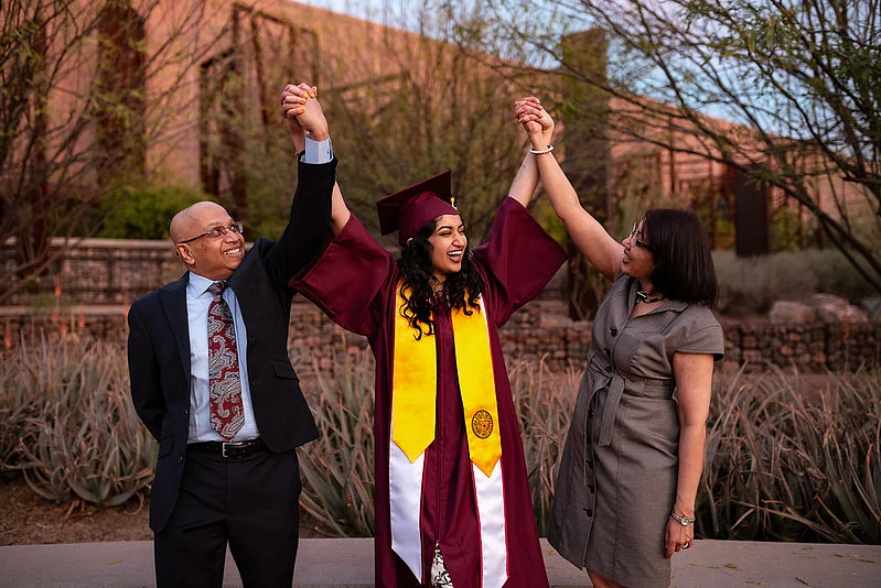 ASU graduate celebrating with parents