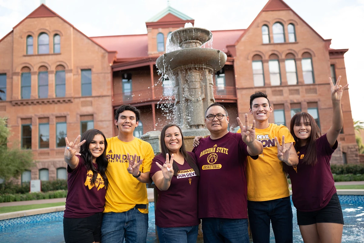 Family standing in front of Old Main on the Tempe Campus 