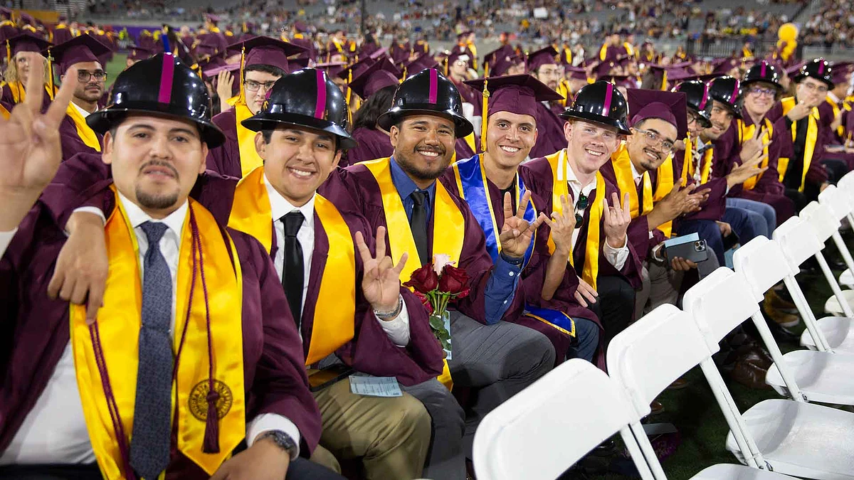 ASU graduates in hardhats at convocation