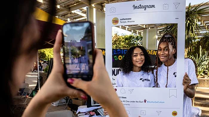 Third-year business and global politics student Roman Mansur talks about the Asian/Asian Pacific American Students' Coalition with first-year business sustainability student Tyna Nguyen at the 2022 Culture Kickoff on Tuesday, Aug. 16, outside the Memorial Union on the Tempe campus.