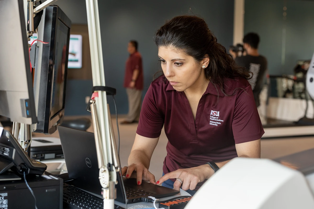 ASU student working on computer.