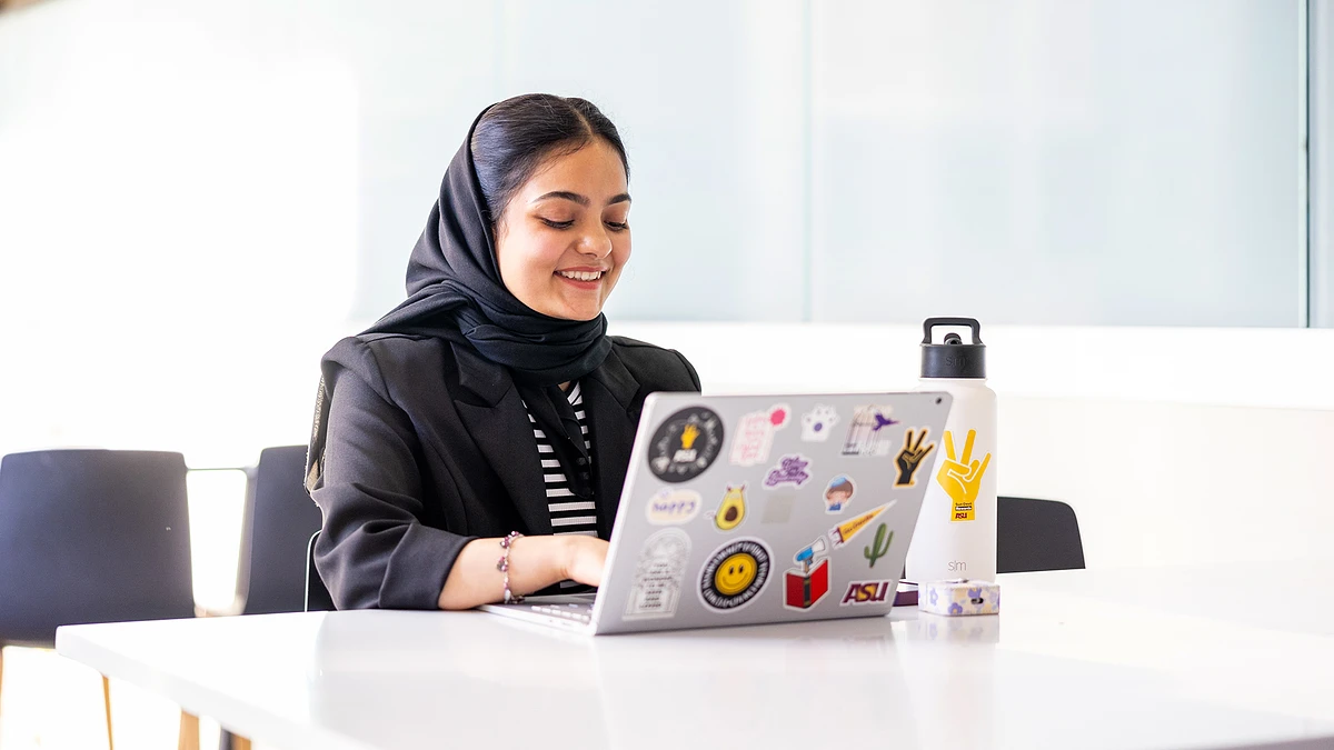  Elham Mansoory works on a laptop, making progress toward earning her degree. The new engineering doctoral degree with a focus in engineering management will enable busy engineers to get the training needed to boost their careers and prepare to lead large teams.