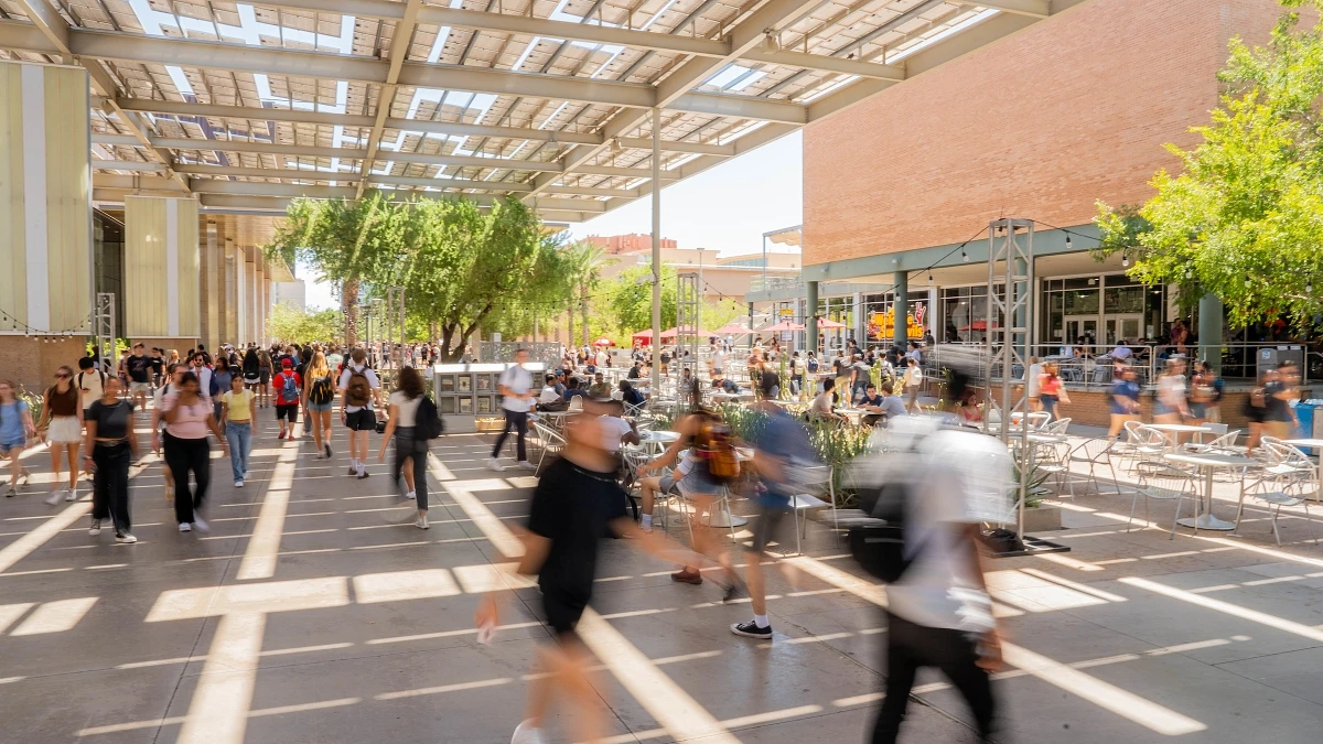 Students walk around outside of the Memorial Union on the first day of classes at the Tempe campus on Aug. 17, 2023.